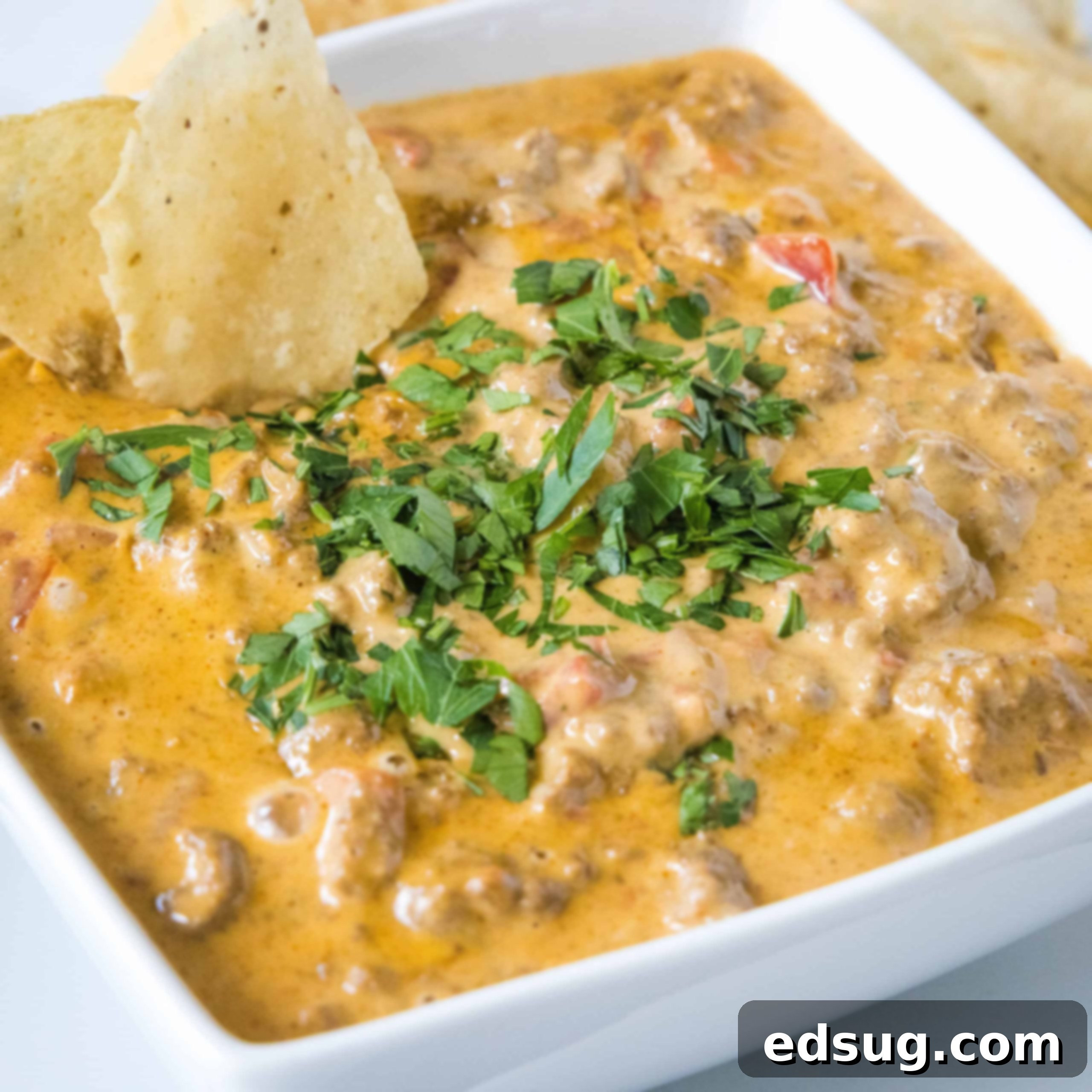 Kickoff Comfort Food 24 Cropped close up of cheesy Rotel dip in a bowl, ready for serving