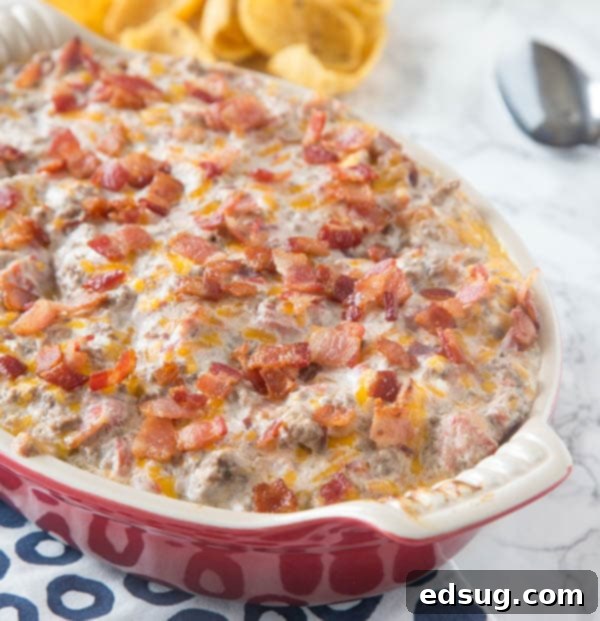 Kickoff Comfort Food 6 Bacon Cheeseburger Dip in a serving dish, showcasing the ooey-gooey texture and toppings