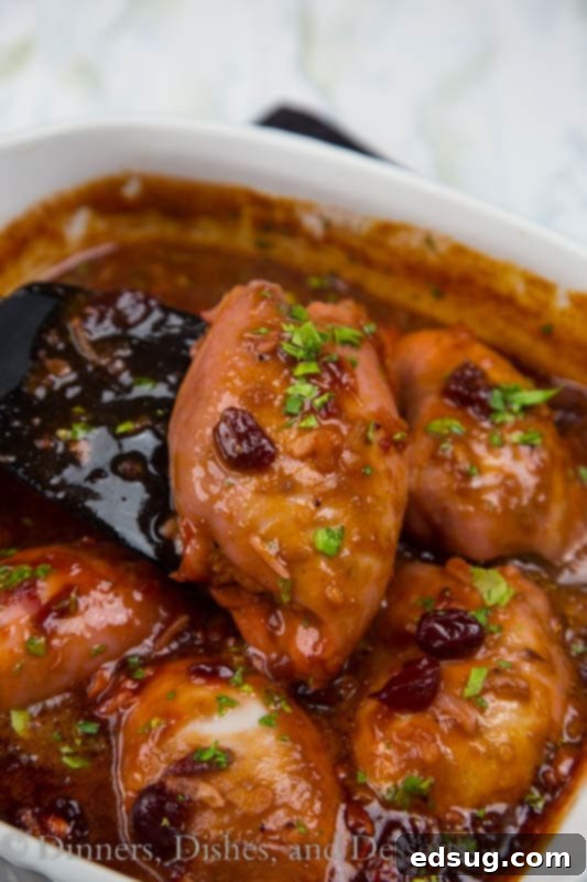 Glazed Cranberry Chicken 2 Baked cranberry chicken in a casserole dish