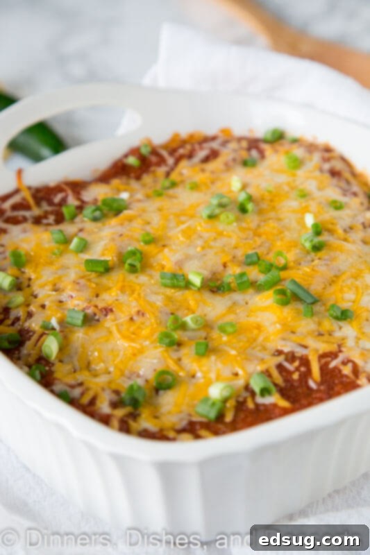 Sky-High Chicken Enchiladas 2 Stacked Chicken Enchiladas - an easy chicken enchilada casserole that is great for weeknights. Much less work, same great taste, so dinner is on the table fast!