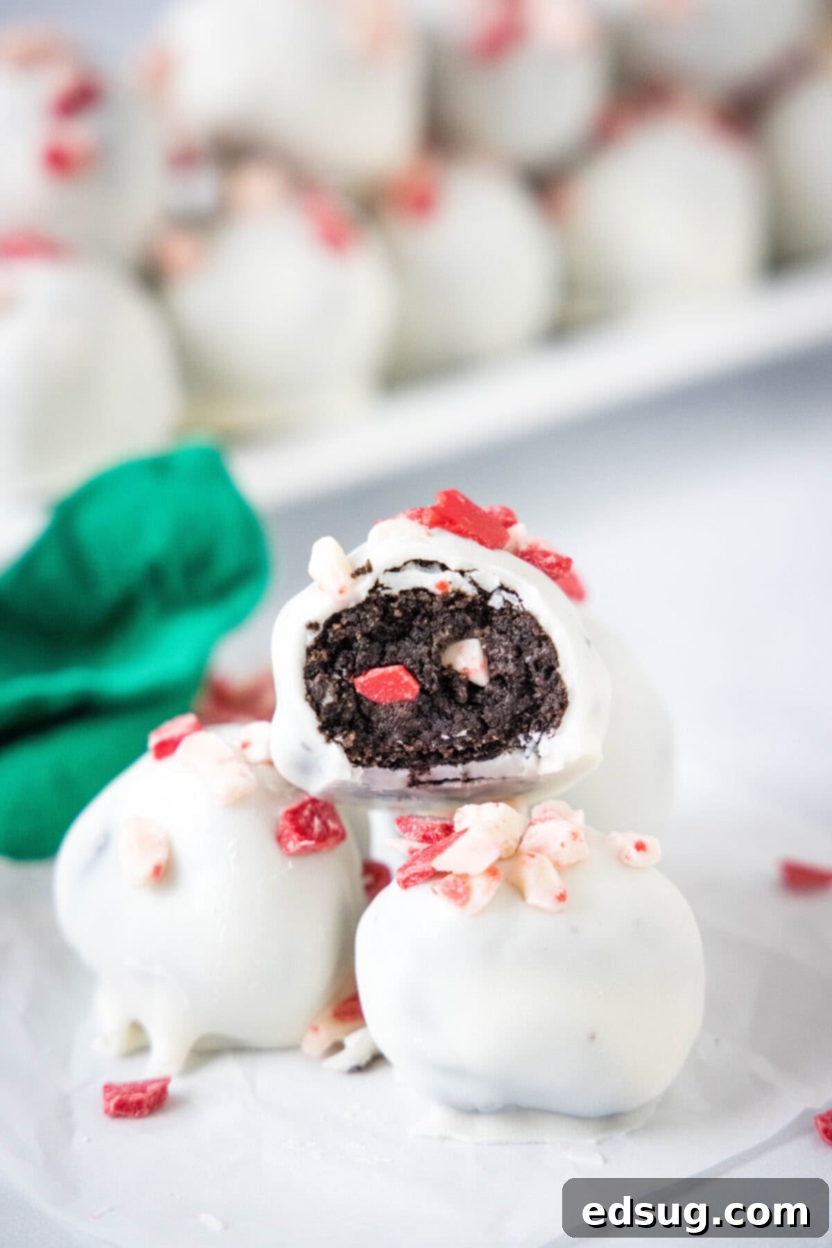 peppermint oreo truffles stacked on a plate