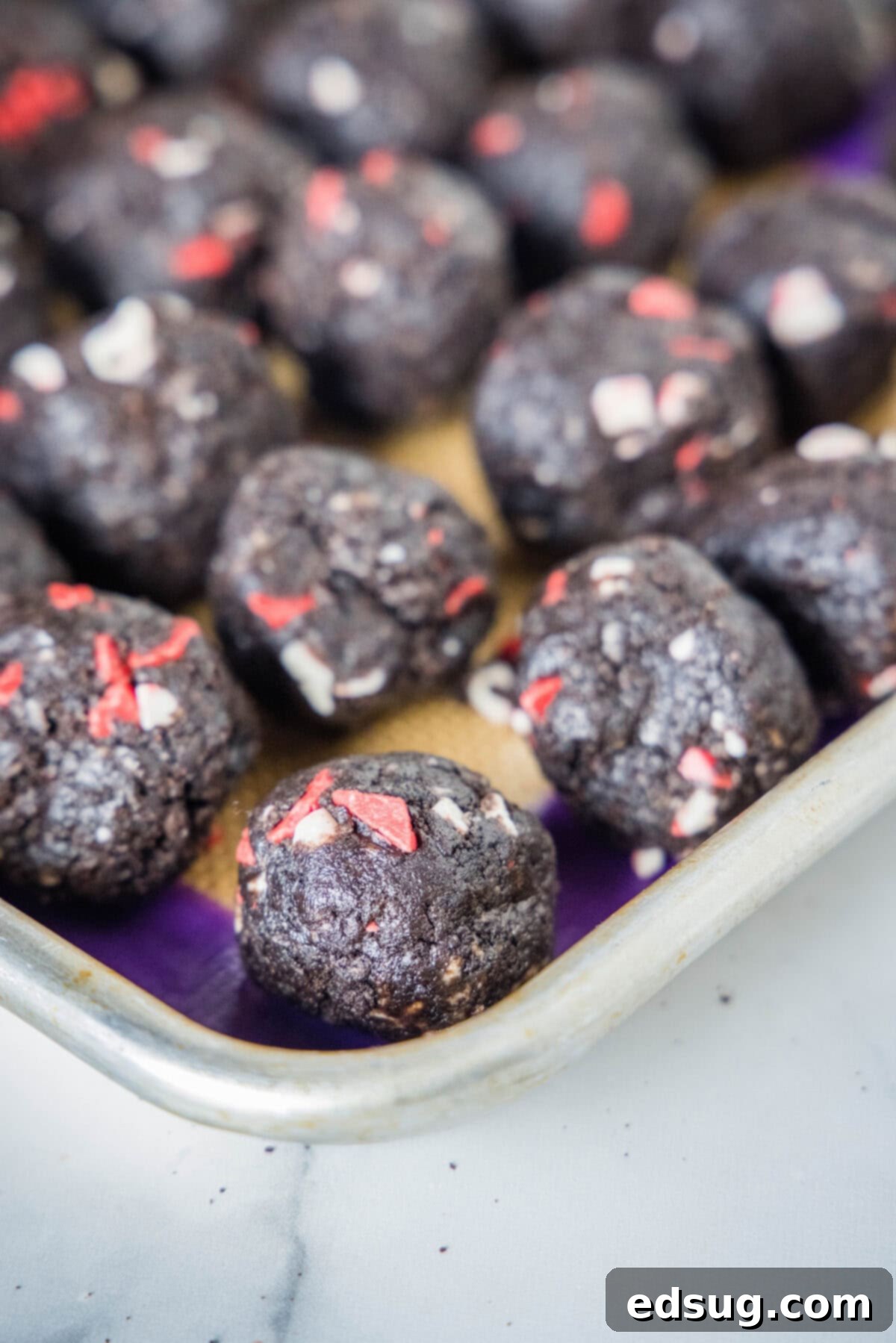 peppermint oreo balls on baking sheet
