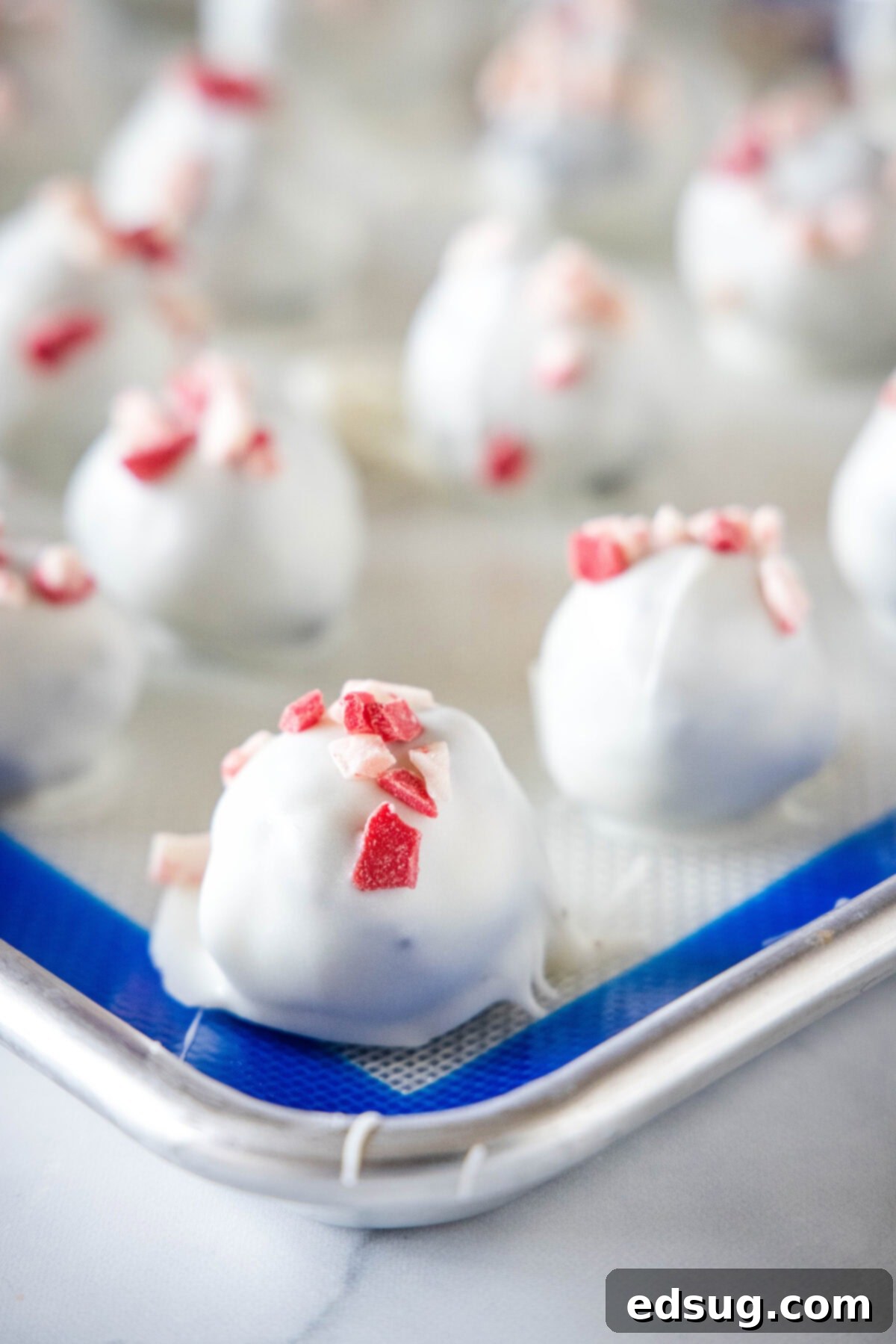 peppermint oreo truffles on a baking sheet