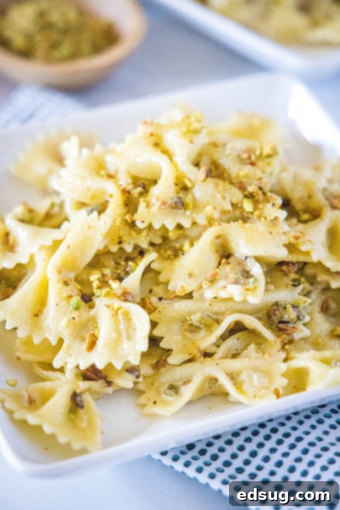 creamy pistachio pasta on a white plate