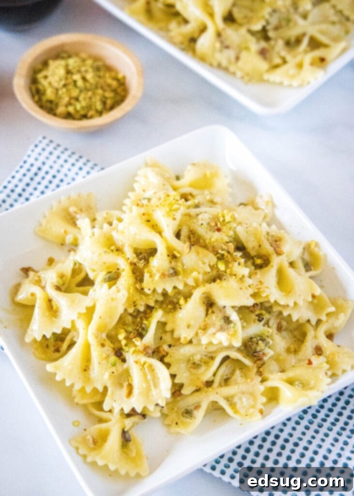 pistachio cream pasta on a white plate