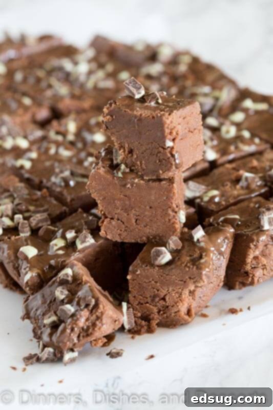 Foolproof Microwave Fudge 6 easy microwave fudge on a plate, stacked in a festive arrangement