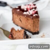Peppermint Chocolate Cheesecake Recipe – a thick and creamy chocolate cheesecake with chocolate ganache and pieces of peppermint candy