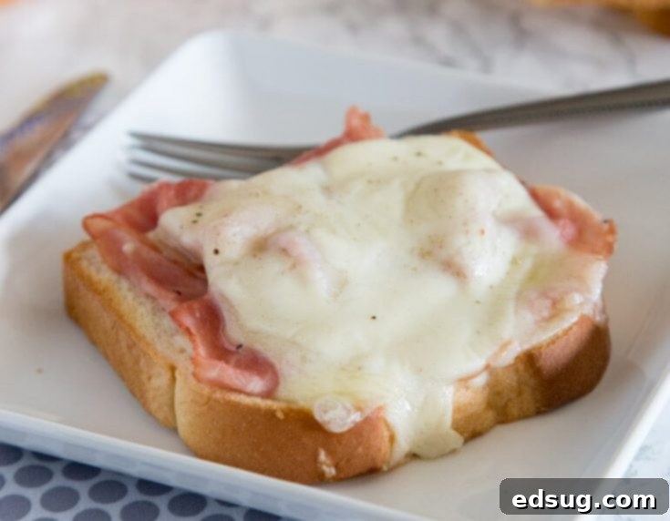 open faced croque monsieur on a plate