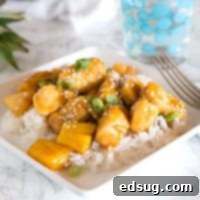 Tropical Pineapple Teriyaki Chicken 6 A plate of food on a table, with Chicken pineapple teriyaki