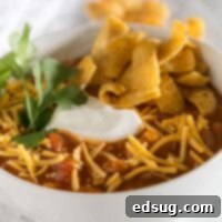 Easy Taco Soup - a hearty and comforting taco flavored soup that is ready in minutes. Top with your favorite toppings to make it even better!