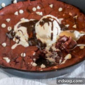 Decadent Red Velvet Skillet Cookie 5 Red Velvet Skillet Cookie - a thick and chewy red velvet cookie baked in a skillet and topped with ice cream and hot fudge.