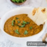 A bowl of Indian Lentil Soup, known as Dal, filled with aromatic spices.