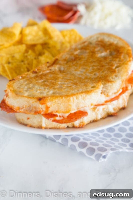 Ingredients for pepperoni pizza grilled cheese laid out: bread, sauce, pepperoni, mozzarella, butter