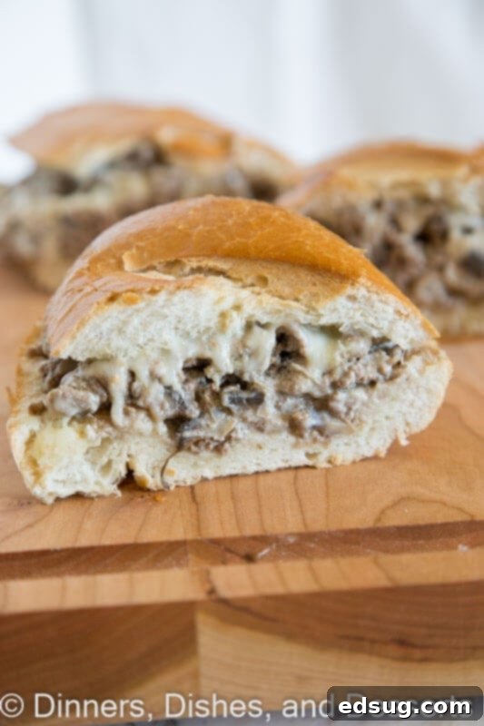 Hearty Beef Stroganoff Bread 2 Beef Stroganoff Stuffed bread on a board, showing a sliced portion