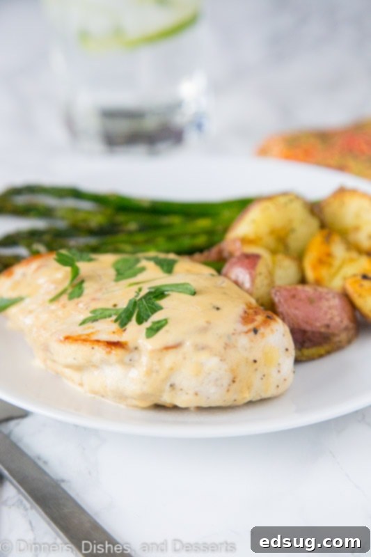 French Herb Skillet Chicken 4 A plate of food on a table, with Chicken and Sauce