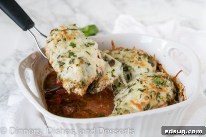 Rustic Italian Chicken Bake 3 scooping chicken out of dish