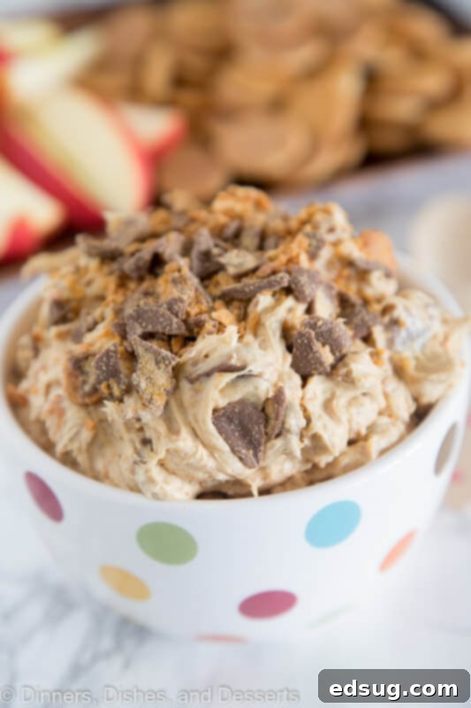 A bowl of creamy peanut butter Butterfinger dip, ready to be served