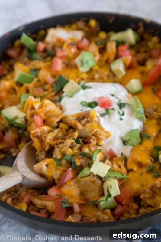 A close-up of the bubbling Beef Burrito Skillet, showing off the ingredients.