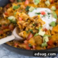 Beef Burrito Skillet - Mix up your taco night with this one pan meal that tastes like a beef burrito in a pan! Top with your favorite taco toppings!