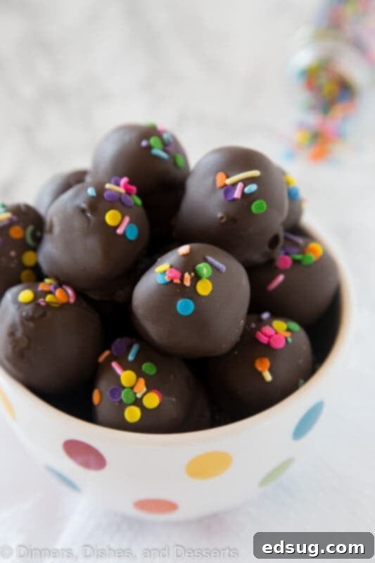A close up of a nutella oreo truffles in a bowl, showcasing its rich texture and chocolate coating.