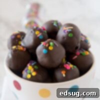 Nutella Oreo Truffles - classic Oreo truffles made even better by adding Nutella! Dipped in chocolate or rolled in sprinkles for an easy chocolate treat.