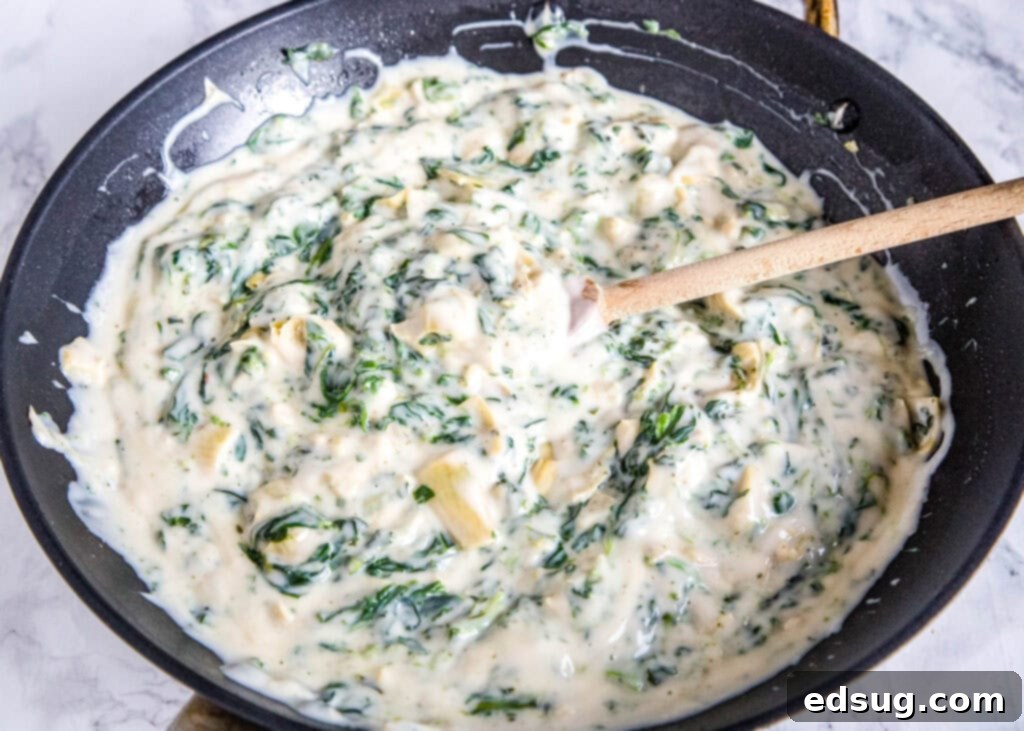 spinach aritchoke sauce in a skillet