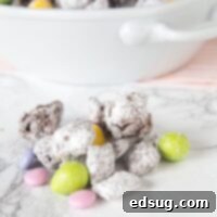 Easter Bunny Chow 5 Easter Muddy Buddies with colorful M&M's and chocolate eggs on a table