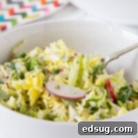 Asian Napa Cabbage Slaw - a crunchy cabbage slaw salad with lots of veggies and a creamy asian style soy dressing. Great for lunches, get togethers or with your next barbecue.