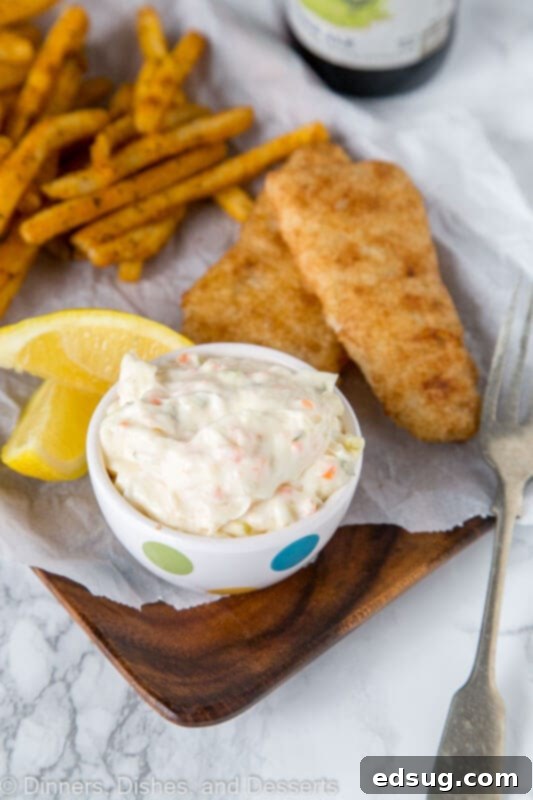The Secret to Red Lobster's Iconic Tartar Sauce 3 A plate of food, with Tartar sauce and Fish and chips