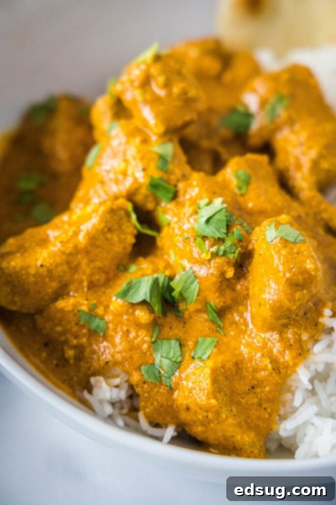 Creamy Butter Chicken Perfection 3 white bowl with butter chicken and rice