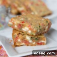 Coconut White Chocolate Blondies - traditional blondies loaded with lots of white chocolate chips, sprinkles, and made with coconut oil. Rich, almost fudgy, and delicious!