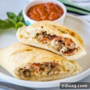 Folded Pizza Pockets 11 close up calzones cut in half on a plate