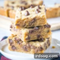 Ultimate Peanut Butter Chocolate Chip Bars 7 Close-up of stacked peanut butter chocolate chip bars with a rich, chewy texture