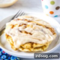 Cinnamon Swirl Pancakes 6 close up of stack of pancakes with cream cheese glaze
