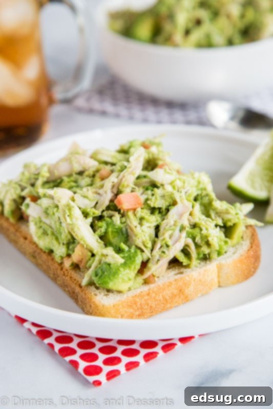 Creamy Avocado Chicken Salad 2 Creamy Chicken Salad with avocados and no mayo, showcasing its vibrant green hue.