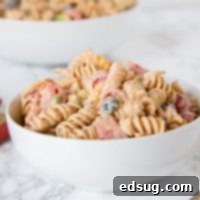 Taco Pasta Salad - a creamy pasta salad with all your favorite taco toppings! Great to make ahead and have in the fridge for dinner or to take to any get together.