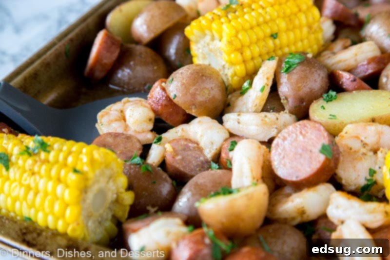A dish is filled with food, shrimp boil