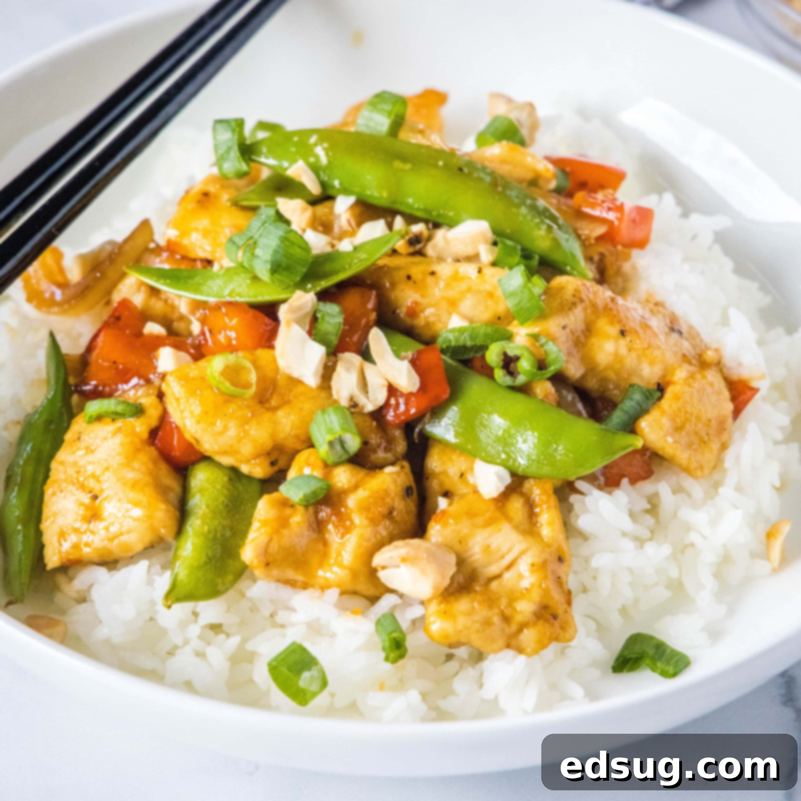 Homemade Asian Outshining the Takeout 11 white bowl with spicy chicken stir fry over white rice