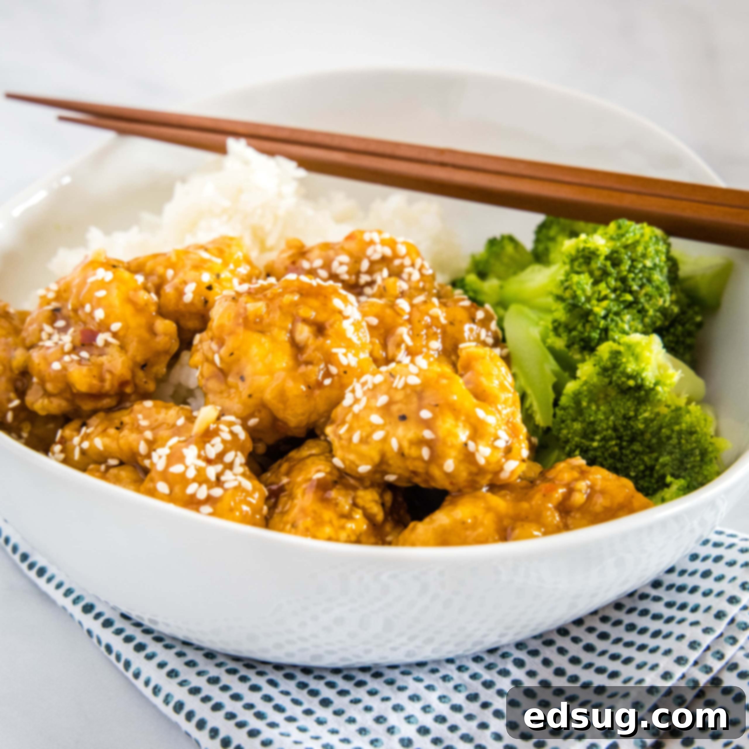Homemade Asian Outshining the Takeout 14 cropped sesame chicken picture with broccoli in white bowl