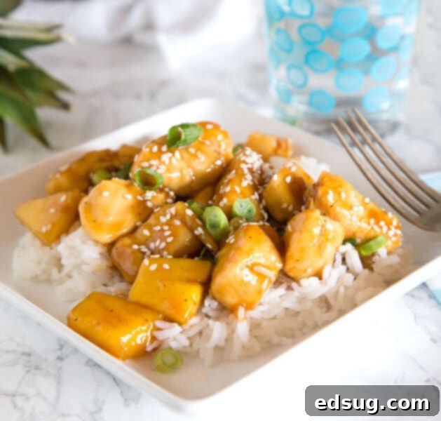 Homemade Asian Outshining the Takeout 29 A plate of food on a table, with Chicken pineapple teriyaki