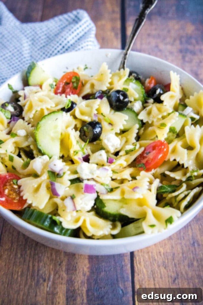 Zesty Greek Pasta Salad 5 greek pasta salad tossed together in a bowl
