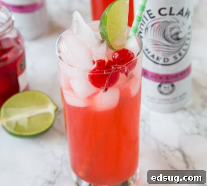 Black Cherry Limeade in a glass with cherries