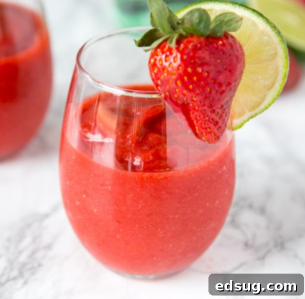 Frozen Strawberry Daiquiri with a strawberry garnish