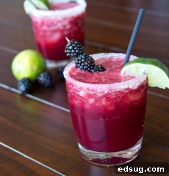 Skinny Blackberry Margaritas garnished with berries