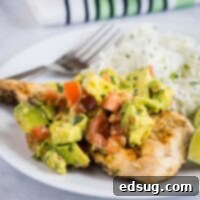 close up avocado chicken on a white plate
