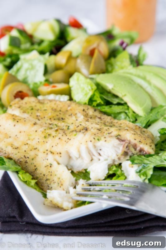 Mediterranean Garlic Herb Salad 2 A vibrant Mediterranean salad topped with perfectly cooked garlic and herb tilapia fillet