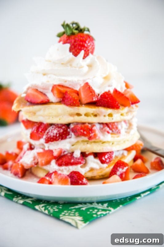 Dreamy Strawberry Shortcake Pancakes 2 The ultimate dessert for breakfast! Fluffy Strawberry Shortcake Pancakes topped with juicy berries and whipped cream.