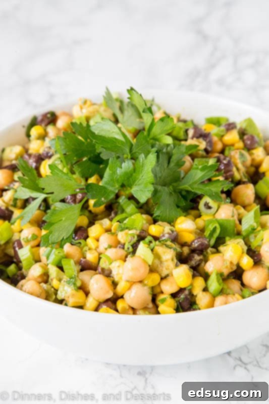 Fiesta Chickpea Salad 2 A bowl of Southwestern Chickpea Salad with fresh vegetables and dressing.