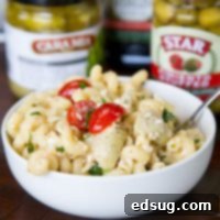 Sun-Kissed Mediterranean Pasta Salad 5 Mediterranean Pasta Salad - an easy pasta salad full of olives, artichoke hearts, tomatoes, parsley, and feta cheese. Topped with a light vinaigrette dressing for a cool and delicious dish.