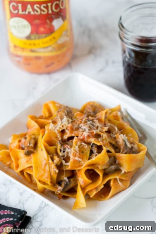 Earthy Mushroom Pappardelle 3 A plate of pasta with a mushroom tomato sauce